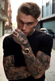 young man with full arm tattoos